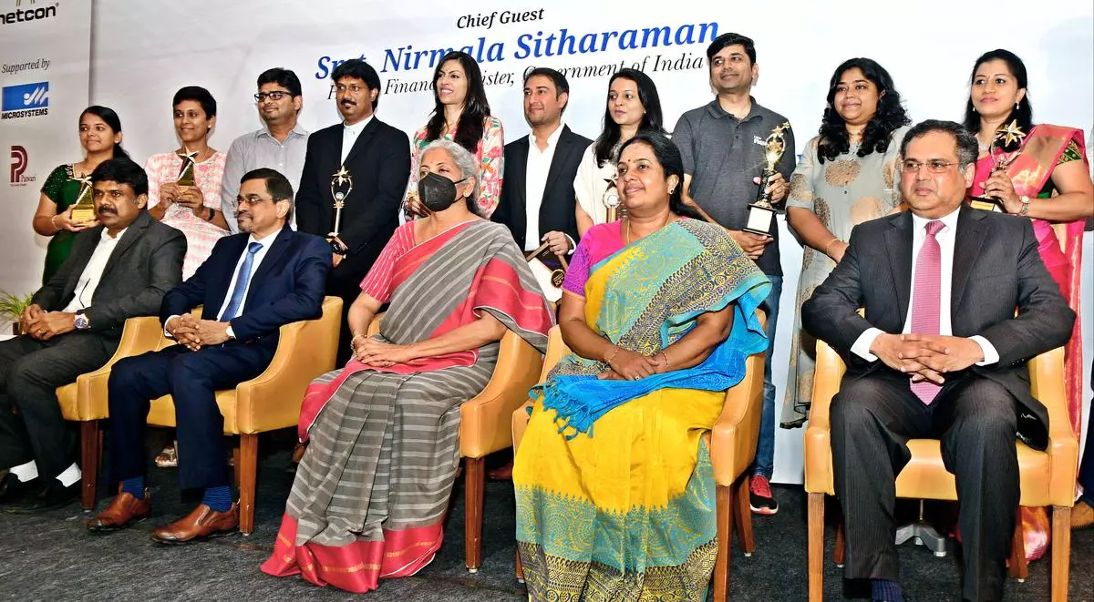 Finance Minister Nirmala Sitharaman with recipients of the Startup Dhruv Award presented by the Startups Academy in Coimbatore on Monday. Vanathi Srinivasan, BJP MLA (Coimbatore South) and Sanjay Jayavarthanavelu (sitting right), Chairman and Managing Director, Lakshmi Machine Works are also seen