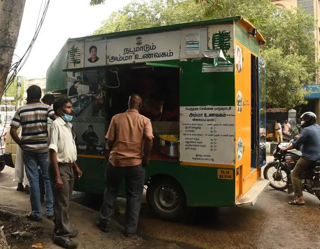 Mobile Amma Canteen in front of a metro water pumping station in Chennai. The food being subsidised, is popular among the labourers as they get lemon, sambar and curd rice for Rs 5 each during lunch time.
Photo : Bijoy Ghosh Mobile Amma Canteen in front of a metro water pumping station in Chennai. The food being subsidised, is popular among the labourers as they get lemon, sambar and curd rice for Rs 5 each during lunch time.
Photo : Bijoy Ghosh