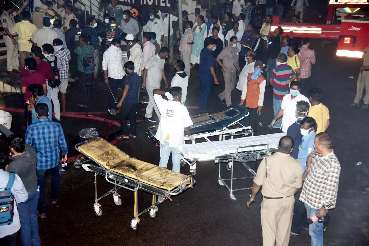 Secundrabad: Rescue operation underway after a fire broke out in an electric bike showroom in Secundrabad, Monday night, Sept. 12, 2022. Fire and smoke from the showroom engulfed a lodge situated above it, killing atleast seven people and injuring five others, according to police. (PTI Photo)