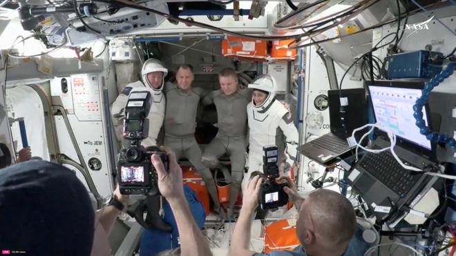 NASA astronaut Butch Wilmore, Roscosmos cosmonaut Aleksandr Gorbunov and NASA astronauts Nick Hague and Suni Williams pose for a photo at the hatch a SpaceX Crew Dragon capsule before closing the hatch in preparation for undocking from the ISS to begin their return to Earth March 17, 2025 in this still image taken from video.     