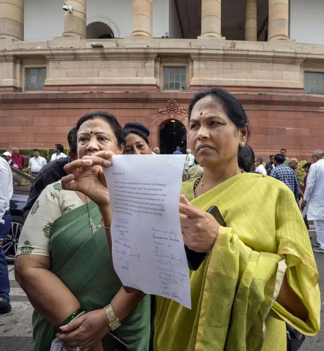 Union Minister Shobha Karandlaje shows a letter to be submitted to Lok Sabha Speaker Om Birla regarding Congress MP Rahul Gandhi’s conduct in the House during the Monsoon Session of Parliament in New Delhi on Wednesday. Union Minister Shobha Karandlaje shows a letter to be submitted to Lok Sabha Speaker Om Birla regarding Congress MP Rahul Gandhi’s conduct in the House during the Monsoon Session of Parliament in New Delhi on Wednesday.