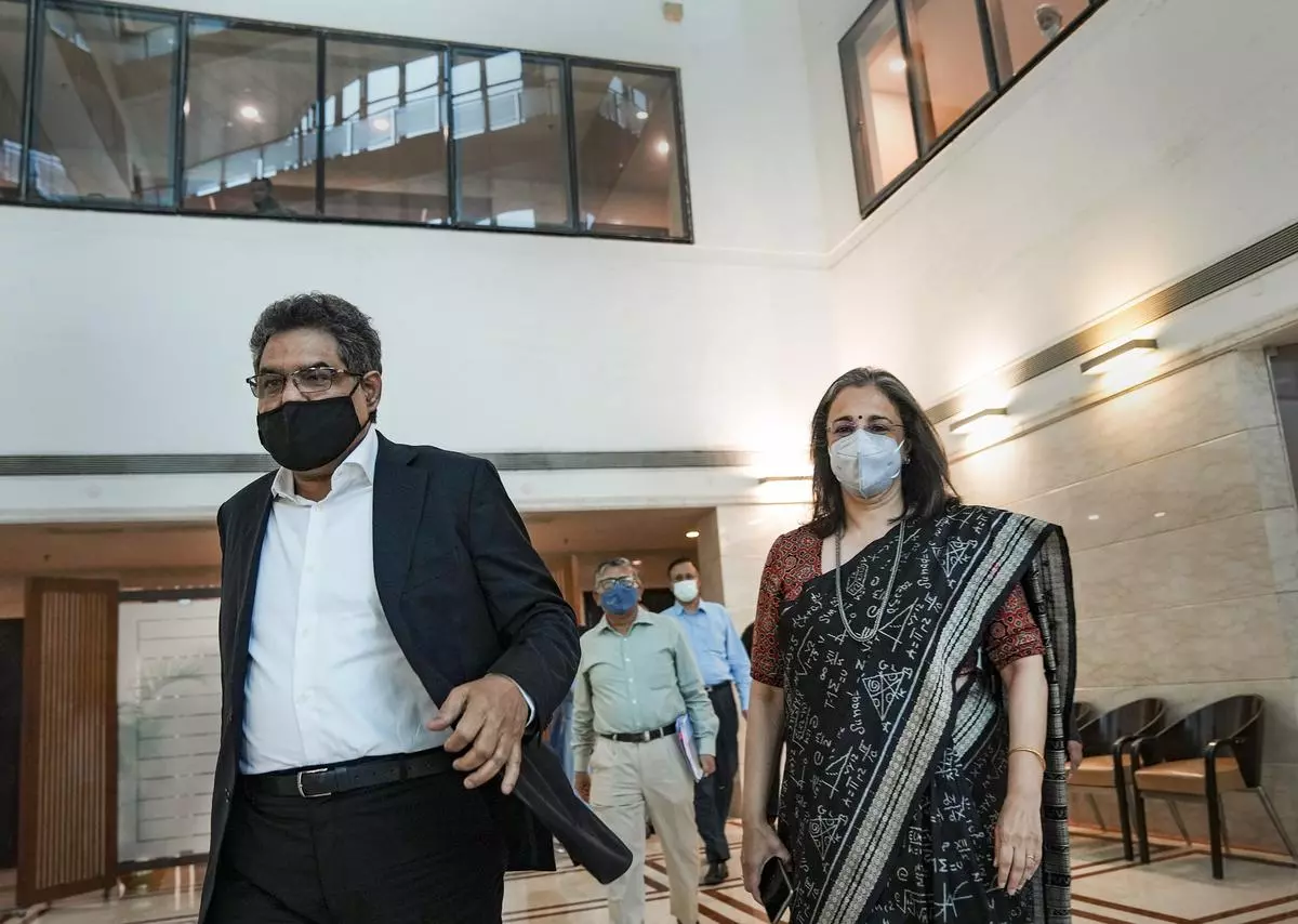 New Chairperson of the Securities and Exchange Board of India Madhabi Puri Buch with her predecessor Ajay Tyagi arrives for a press conference after taking charge at the SEBI office, in Mumbai on Wednesday