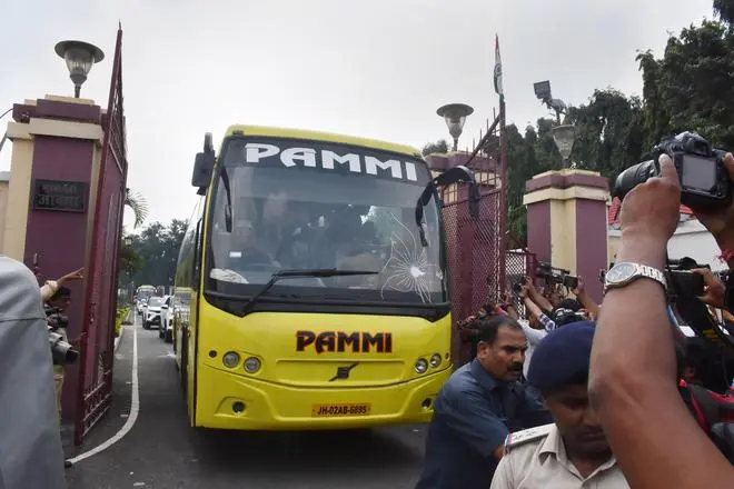 A bus carrying Jharkhand UPA MLAs leaves from the residence of CM Hemant Soren after a meeting, amid speculation of his disqualification, in Ranchi. A bus carrying Jharkhand UPA MLAs leaves from the residence of CM Hemant Soren after a meeting, amid speculation of his disqualification, in Ranchi.