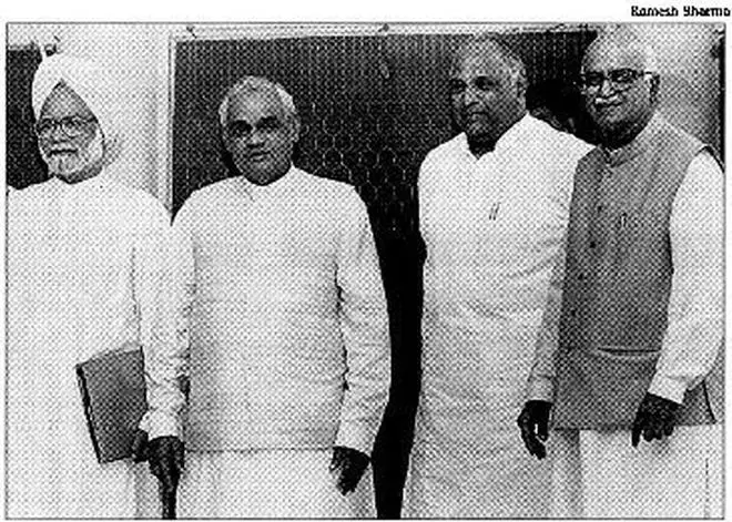 The Prime Minister, A.B. Vajpayee, with the former Finance Minister, Manmohan Singh, the Congress leader, Sharad Pawar, and the Home Minister, L.K. Advani, during a meeting in the Capital on Thursday.