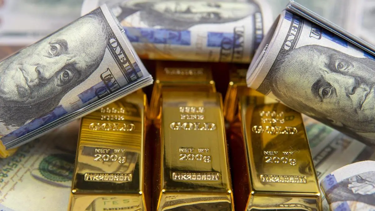 Gold set for third weekly fall on hawkish US Fed, elevated dollar