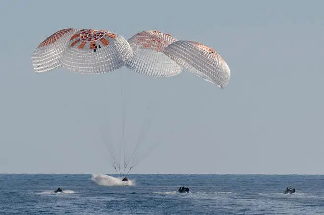 In this image provided by NASA, a SpaceX capsule splashes down in the Gulf of Mexico, Tuesday, March 18, 2025, as it lands off the coast of Florida with NASA astronauts Suni Williams, Butch Wilmore and Nick Hague, and Russian cosmonaut Alexander Gorbunov. 