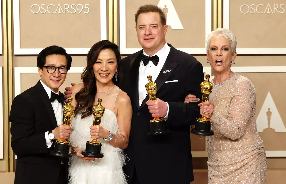 Best Supporting Actor Ke Huy Quan, Best Actress Michelle Yeoh, Best Actor Brendan Fraser and Best Supporting Actress Jamie Lee Curtis pose with their Oscars  at the 95th Academy Awards 