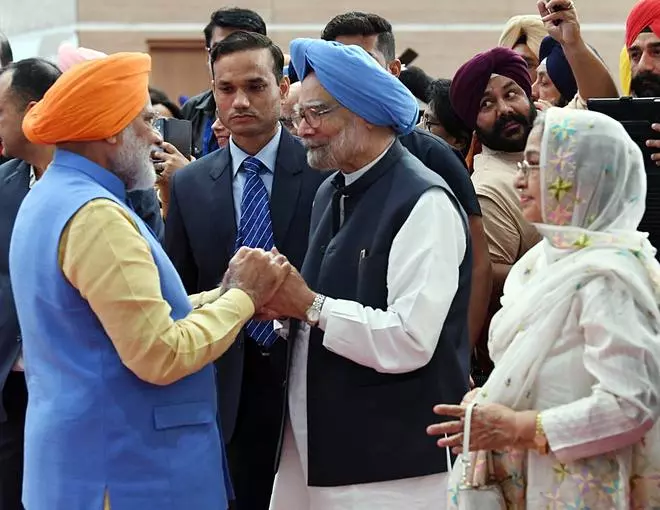 In this file image from Saturday, November 9, 2019, Prime Minister Narendra Modi greets former Prime Minister Manmohan Singh during an event to inaugurate the passenger terminal building of the Kartarpur corridor on the Indian side, also known as the Integrated Check Post, in Gurdaspur.