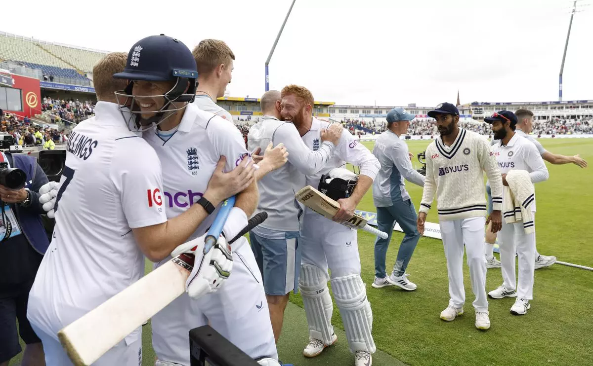 
England’s Jonny Bairstow and Joe Root celebrate with teammates after winning the fifth Test match against India in Edgbaston, Birmingham
