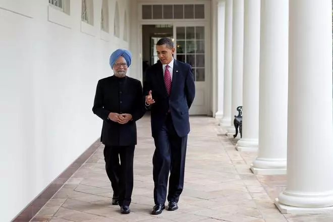 President Barack Obama walks with Prime Minister Manmohan Singh of India along the Colonnade of the White House, Nov. 24, 2009.  