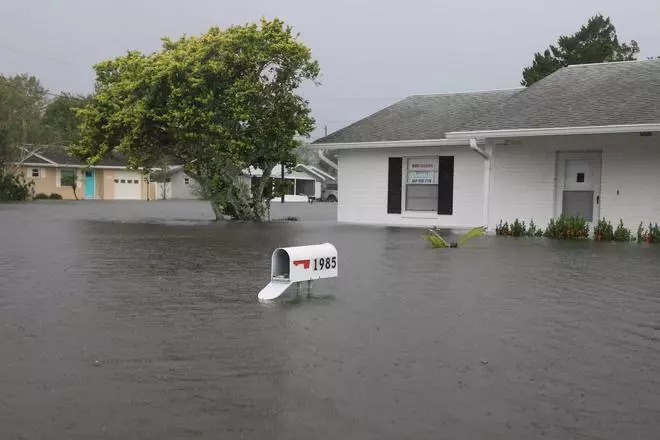 A mailbox whose door was forced open remains above flooding after Hurricane Milton passed in South Daytona, Florida, U.S. October 11, 2024. 