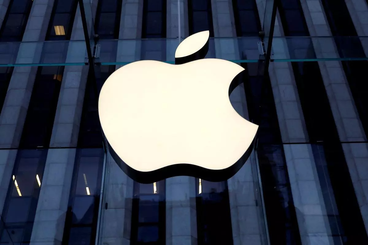 The Apple Inc. logo is seen hanging at the entrance to the Apple store. REUTERS/Mike Segar/File Photo