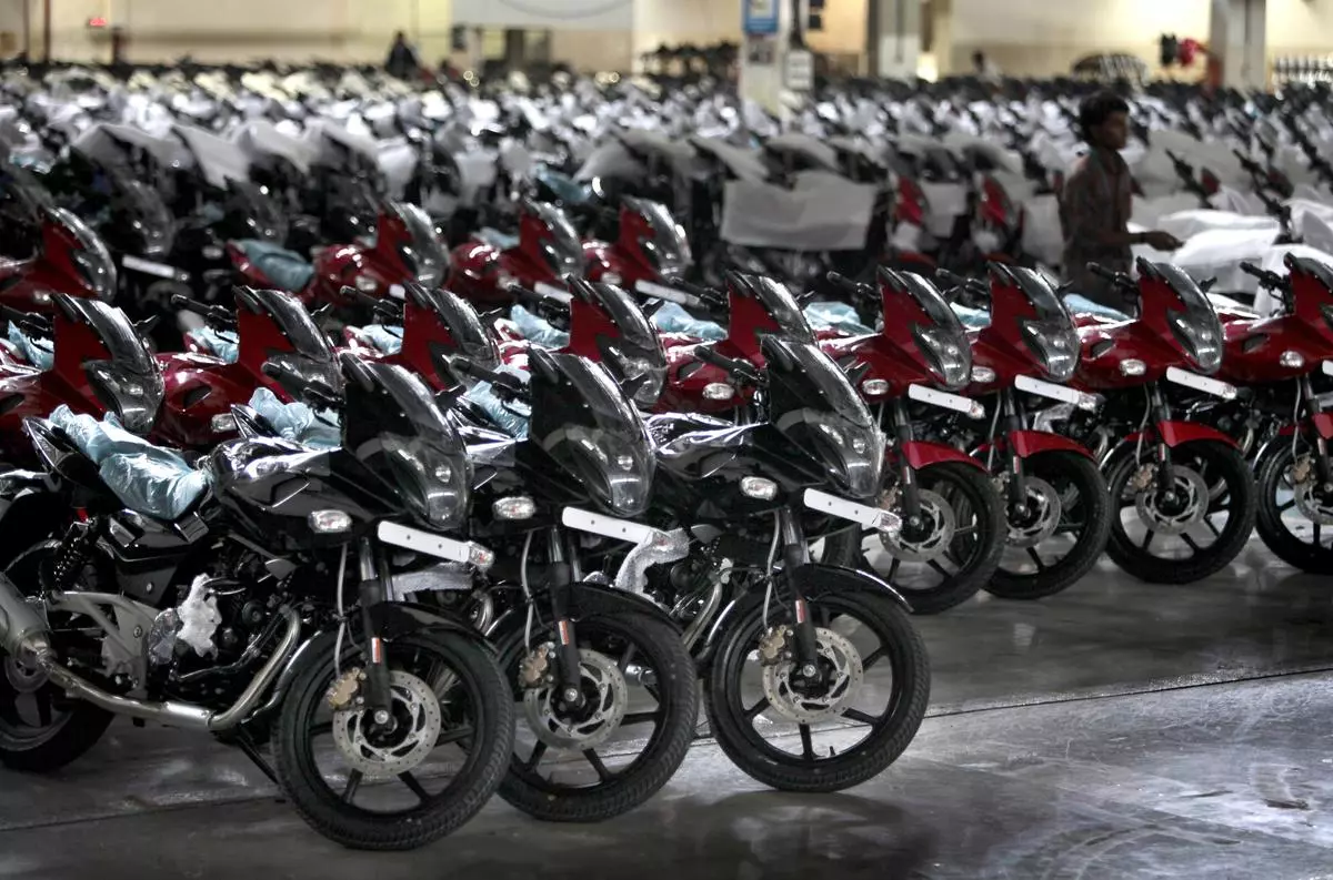 Bajaj Auto’s Pulsar motorcycles sit ready at the end of the assembly line at the company’s factory in Pune