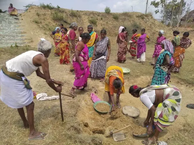 MGNREGA workers in KG Kandigai digging a pond