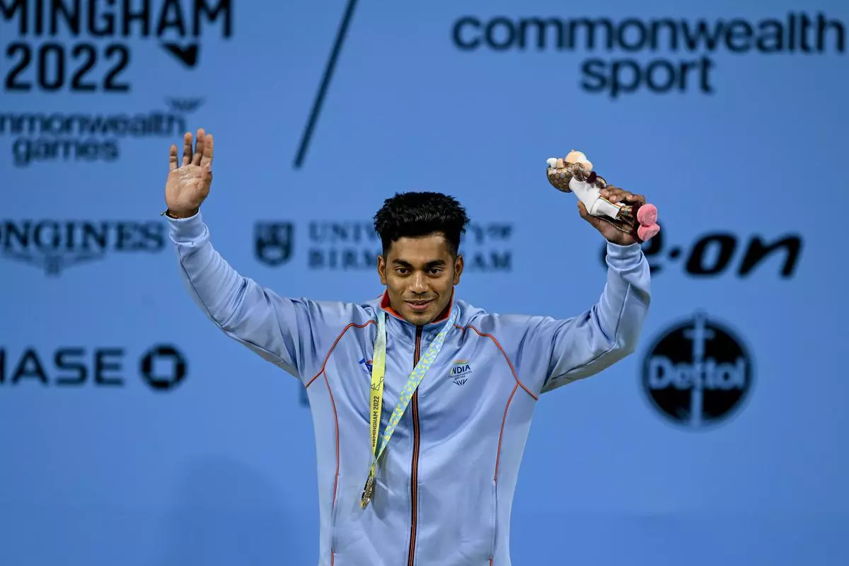 India’s Achinta Sheuli with the gold medal after winning the men’s 73kg weightlifting category match of the Commonwealth Games 2022 (CWG), in Birmingham, UK, Sunday, July 31, 2022. 