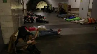 People take shelter inside a metro station during a Russian drone and missile strike, amid Russia’s attack on Ukraine, in Kyiv, Ukraine