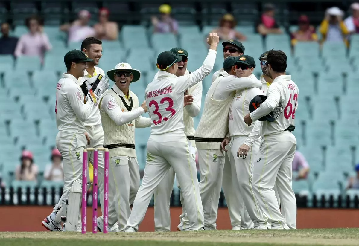 Australia’s Steve Smith looks on as teammates celebrate after he takes a catch that is given not out as the ball touched the ground in the Third Test match between Australia and South Africal at the Sydney Cricket ground, in Australia at January 7, 2023. - REUTERS/Jaimi Joy