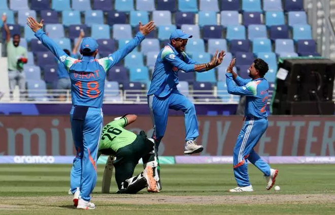 India’s Axar Patel celebrates with Kuldeep Yadav after running out Pakistan’s Imam-ul-Haq