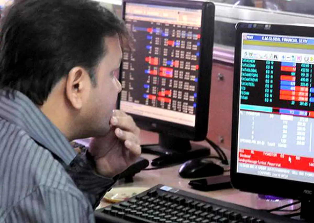 A stock broker reacts as he watches the Sensex that declined 359 points on Tuesday, May 31, 2022. 