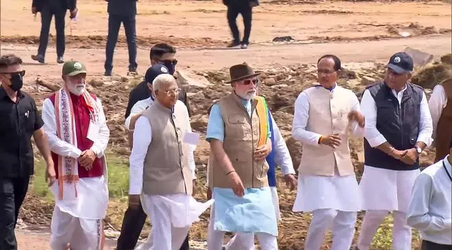 Prime Minister Narendra Modi, Madhya Pradesh CM Shivraj Singh Chouhan and others arrive to release cheetahs inside a special enclosure of the Kuno National Park in Madhya Pradesh, Saturday, Sept. 17, 2022. 