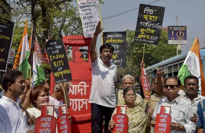 Congress activists shout slogan in a protest demonstration against price hike of commercial and cooking gas and spread of adenovirius, in Kolkata, on Sunday