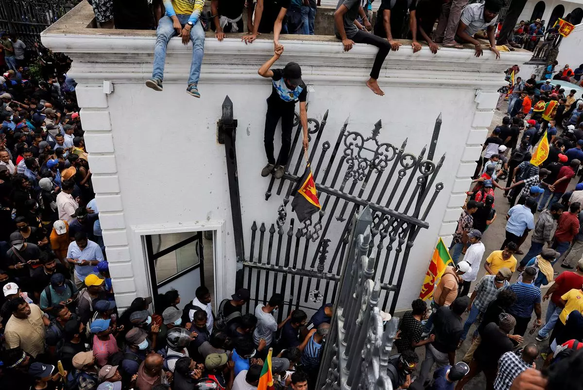 Demonstrators protest inside the President’s House premises, after President Gotabaya Rajapaksa fled, amid the country’s economic crisis, in Colombo, Sri Lanka, on Saturday. 
