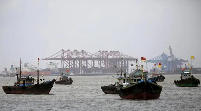 Fishing trawlers are seen in front of the Jawaharlal Nehru Port Trust in Mumbai Fishing trawlers are seen in front of the Jawaharlal Nehru Port Trust in Mumbai