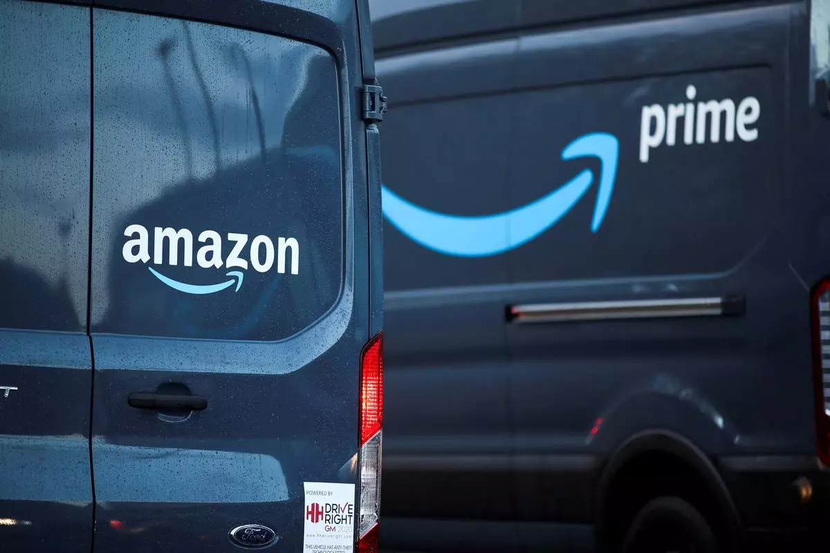 Logos of Amazon and Amazon Prime are pictured on vehicles 
