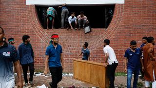 People carry furniture and other items from the Ganabhaban, the Prime Minister’s residence, after the resignation of Prime Minister Sheikh Hasina in Dhaka, Bangladesh