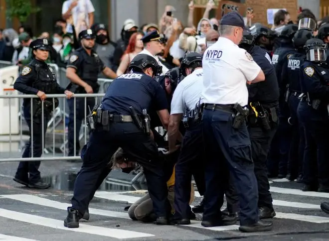Law enforcement officers detain a demonstrator during a protest against federal immigration sweeps near the U.S. immigration court at the Jacob K. Javits Federal Building in New York City, U.S., June 10, 2025. 