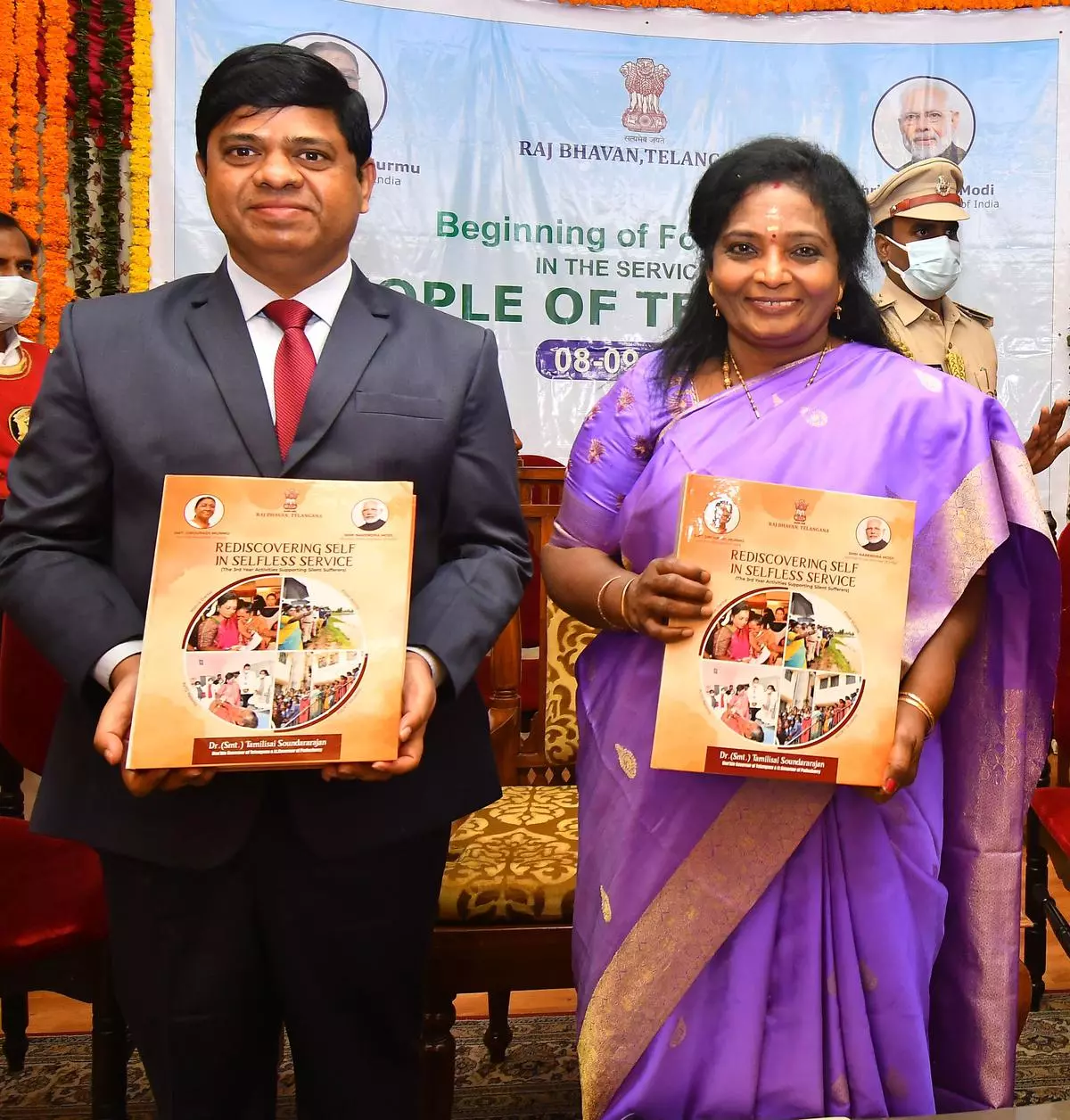 Telangana Governor and Lt Governor of Puducherry Dr. Tamilisai Soundararajan along with the Secretary to Governor K. Surendra Mohan release coffee table book on her work on completion of third year at Raj Bhavan in Hyderabad