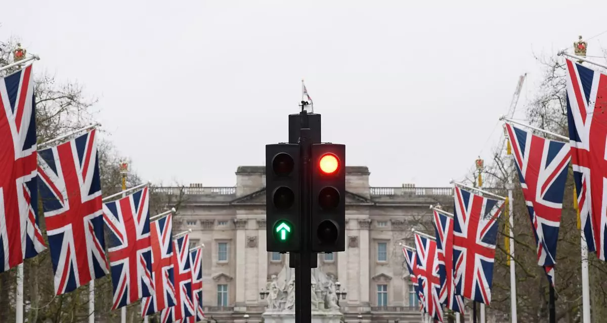 British union flags are seen along The Mall, with Buckingham Palace behind in London.