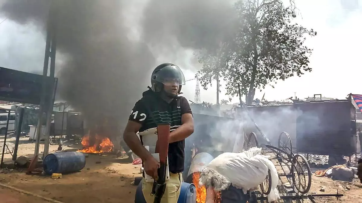 Himmatnagar: A policeman at the site after a communal clash during the Ram Navami procession, in Himmatnagar, Sunday, April 10