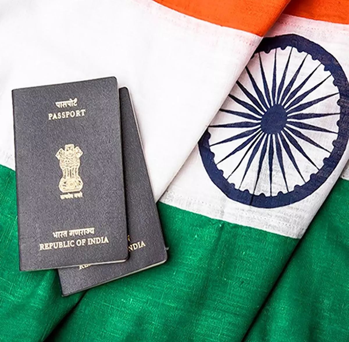 indian passport and authentic indian tricolour flag made up of khadi or pure cotton material