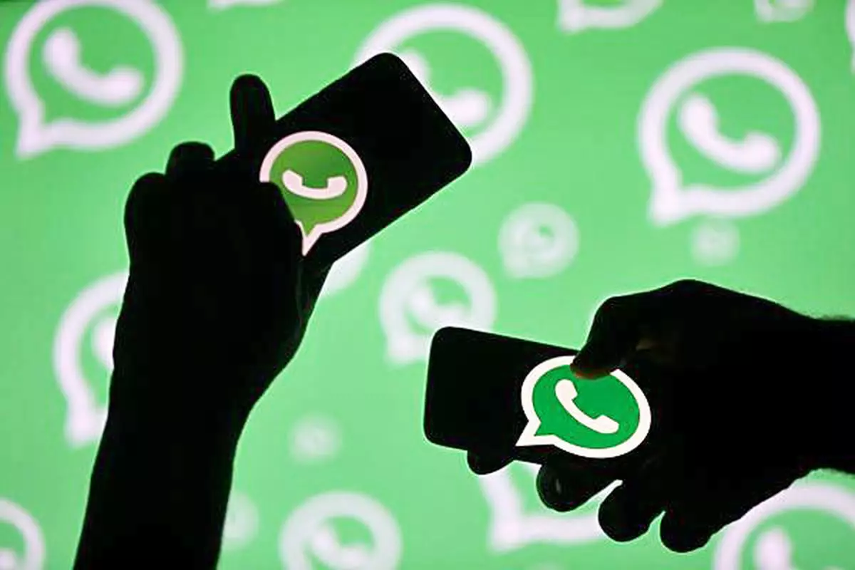 Whatsapp logo displayed on smartphone screens in this illustration.