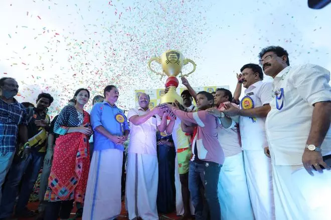 Tropical Titans receive winning trophy from Kerala Finance Minister KN Balagopal at Kollam on Saturday