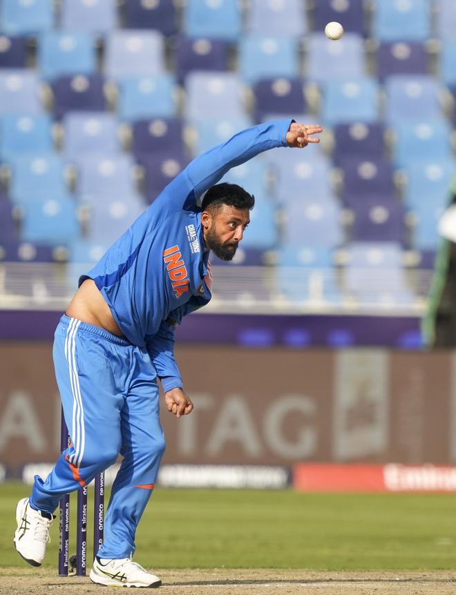 India’s Varun Chakravarthy bowls during the ICC Champions Trophy semi-final cricket match between India and Australia.