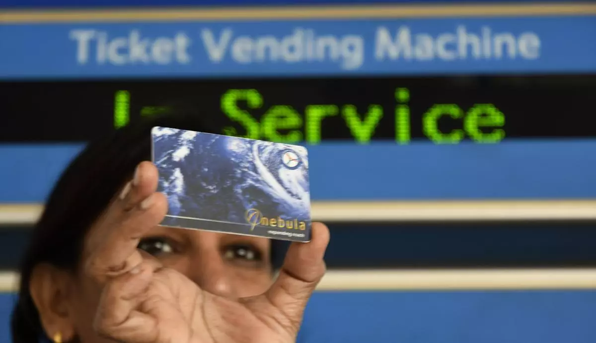 File image: Hyderabad Metro Rail staff displaying the smart card at Nagole Metro station in the city