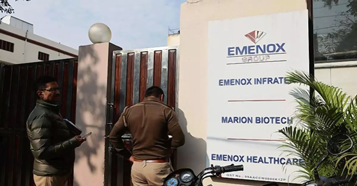 Police is seen at the gate of an office of Marion Biotech, a healthcare and pharmaceutical company and a part of the Emenox Group, whose cough syrup has been linked to the deaths of children in Uzbekistan, in Noida. REUTERS/Anushree Fadnavis