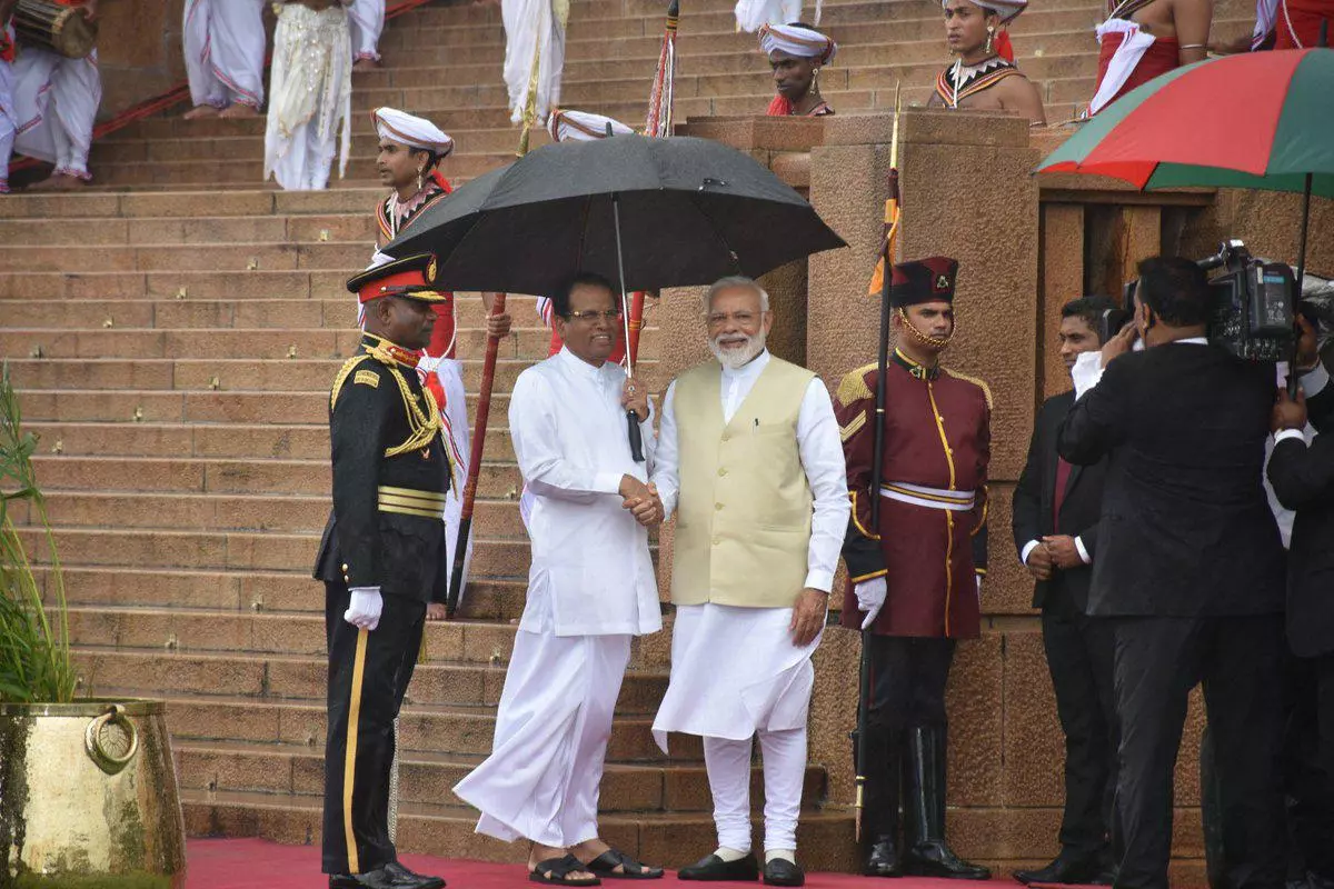 India's Prime Minister Narendra Modi is seen with Sri Lanka's President  Maithripala Sirisena during his welcome ceremony at the Presidential  Secretariat in Colombo