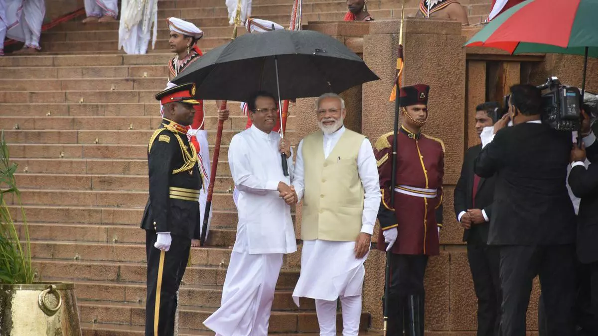 India's Prime Minister Narendra Modi shakes hands with Sri Lanka's  President Maithripala Sirisena during his welcome ceremony at the  Presidential Secretariat in Colombo