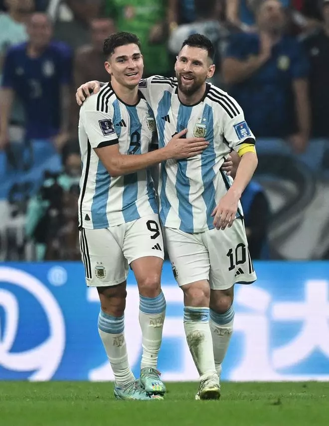 Argentina’s Julian Alvarez celebrates scoring their third goal with Lionel Messi.