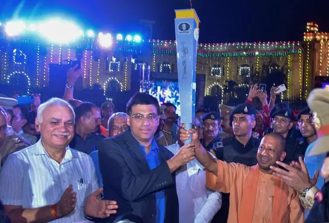 Uttar Pradesh Chief Minister Yogi Adityanath hands over the Torch Relay of the Olympiad to Indian chess Grandmaster Viswanathan Anand during an event, in Lucknow on June 26, 2022. The torch is being taken to 75 cities in a span of 40 days before reaching its destination Mahabalipuram. Uttar Pradesh Chief Minister Yogi Adityanath hands over the Torch Relay of the Olympiad to Indian chess Grandmaster Viswanathan Anand during an event, in Lucknow on June 26, 2022. The torch is being taken to 75 cities in a span of 40 days before reaching its destination Mahabalipuram.