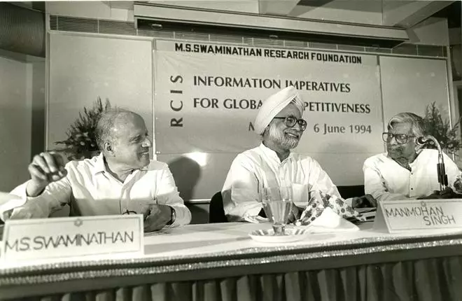 The Union Finance Minister, Dr. Manmohan Singh, releases a book to mark the inauguration of a seminar on “Information Imperatives for Global Competitiveness,” as M. S. Swaminathan (left) and C. Subramaniam look on at Taramani in Madras on June 6, 1994.
 