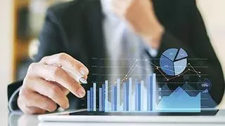 businessman investment consultant analyzing company financial report balance sheet statement working with digital graphs. Concept picture for stock market, office, tax,and project. 3D illustration. istock photo for BL