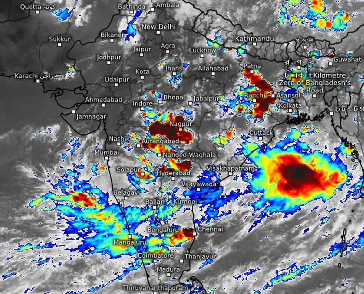 Dense monsoon clouds hung over parts of Maharashtra, Madhya Pradesh and East India while the offshore trough showed signs of life on Tuesday as rainfall deficit was cut down to 2 per cent for the country as a whole.