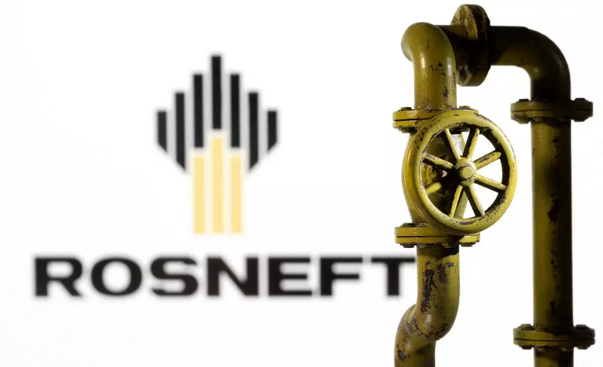 A 3D printed natural gas pipeline is placed in front of displayed Rosneft logo in this illustration. REUTERS/Dado Ruvic/Illustration/File Photo