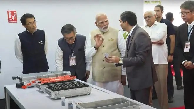 Prime Minister Narendra Modi with Gujarat Chief Minister Bhupendra Patel and others during a flagging off ceremony of Maruti Suzuki’s first electric vehicle e-Vitara from Hansalpur manufacturing facility, Gujarat
