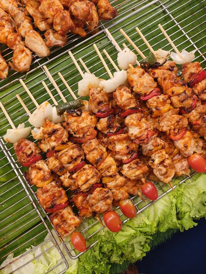 Skewers ready for the grill at a night market  