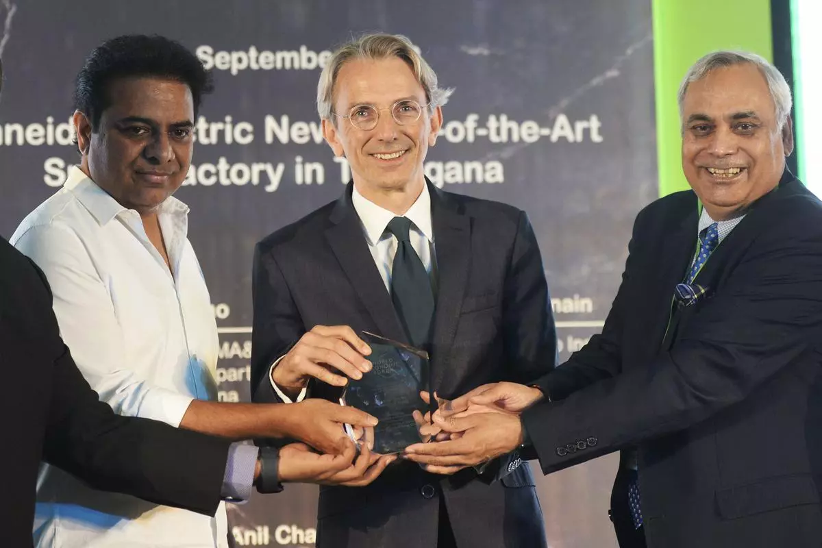 Ambassador of France to India Emmanuel Lenain (C) talks to Telangana’s minister of IT and Industries KT Rama Rao (L) attend the groundbreaking ceremony of a Schneider Electric smart factory in Hyderabad